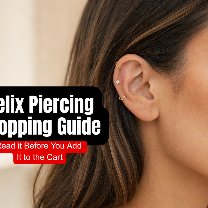 Female model wearing a delicate gold hoop in the upper helix of her ear.