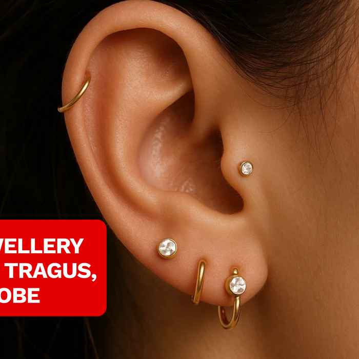 close up of female model wearing helix piercing, tragus piercing and lobe piercings