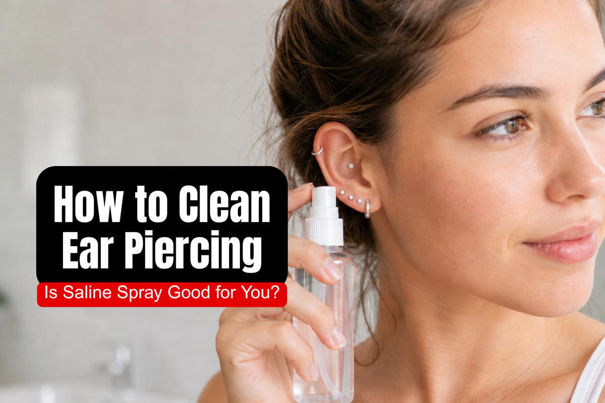 Young woman using sterile saline spray to clean a newly pierced ear with a curated silver ear stack.