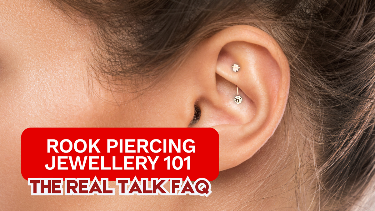 close up of female model ear wearing gold rook piercing in upper inner ear cartilage piercing