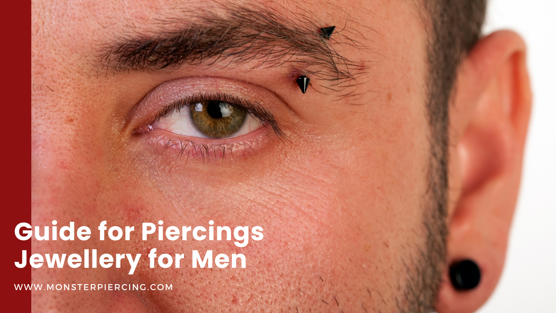 close up of man wearing curved barbell as eyebrow piercing