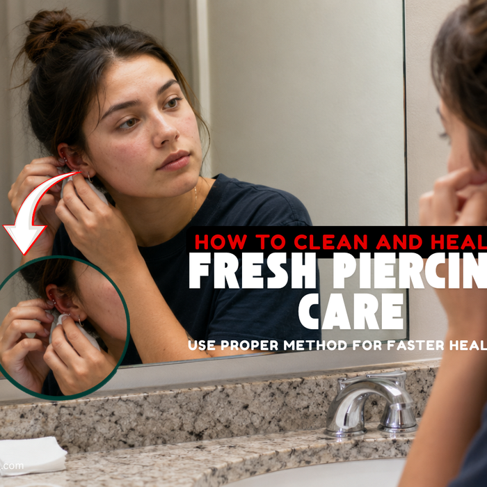 Woman checking a new ear piercing in a bathroom mirror with saline aftercare products nearby