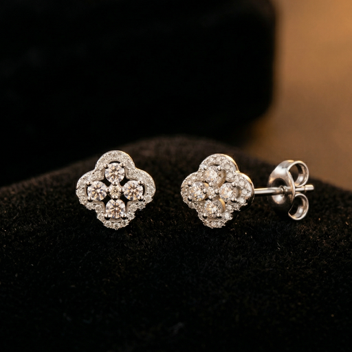 Pair of diamond earrings on a dark background